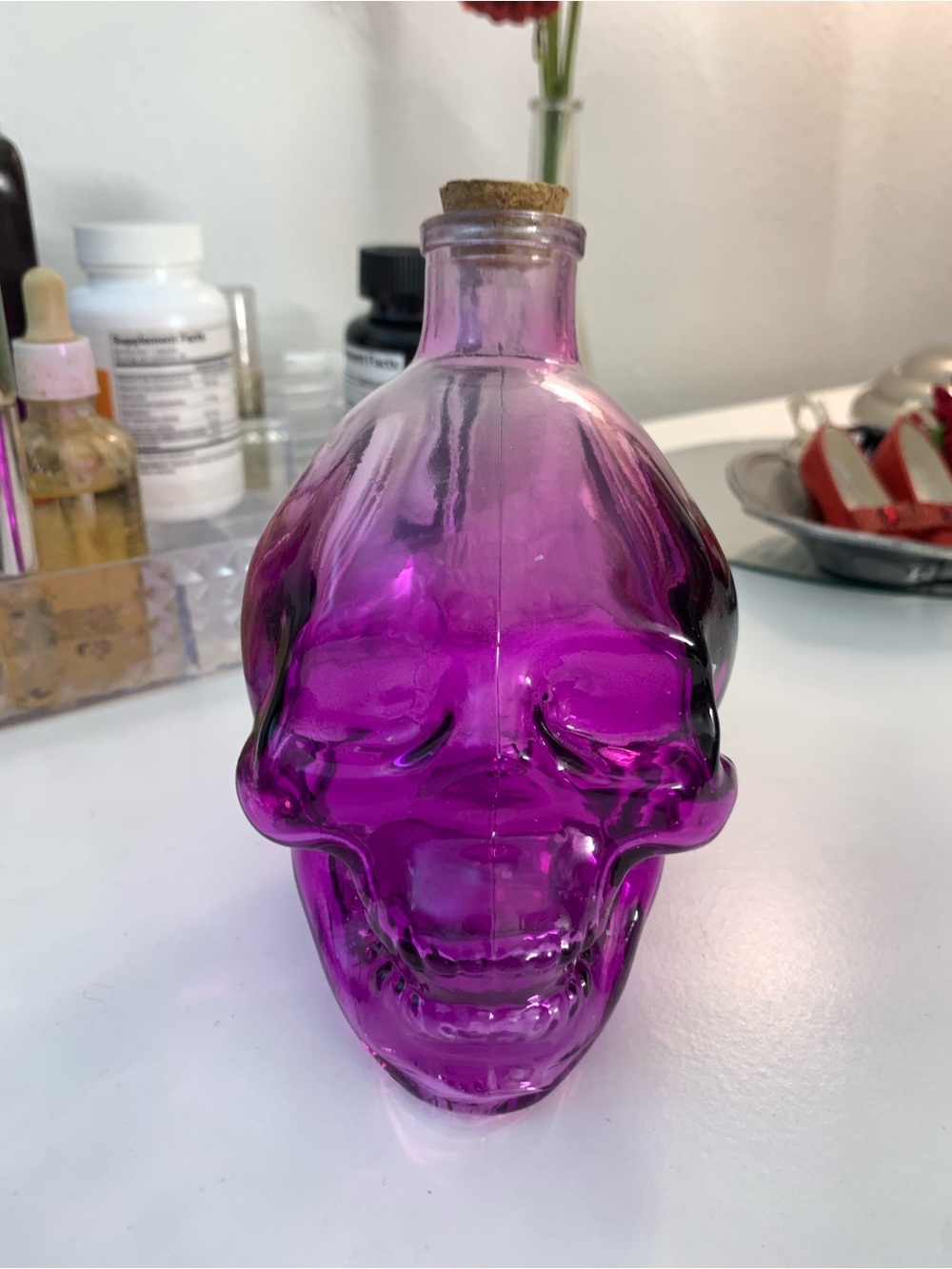 Decorative Purple Glass Skull Bottle with Cork Top